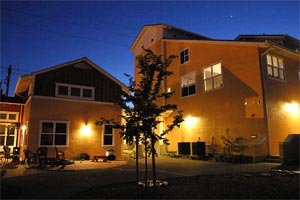 FrogSong Common House at night
